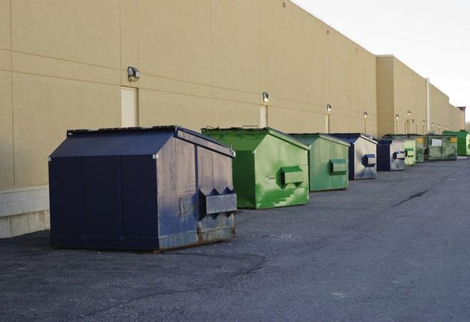 red and green waste bins at a building project in Medford